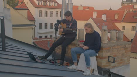 musicians of a music school are preparing for a performance on the roof.