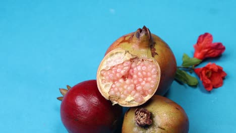 ripe, juicy pomegranate fruit on a blue background