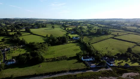 aerial view traeth coch pentraeth farmland rolling green countryside with vacation cottages along salt marsh