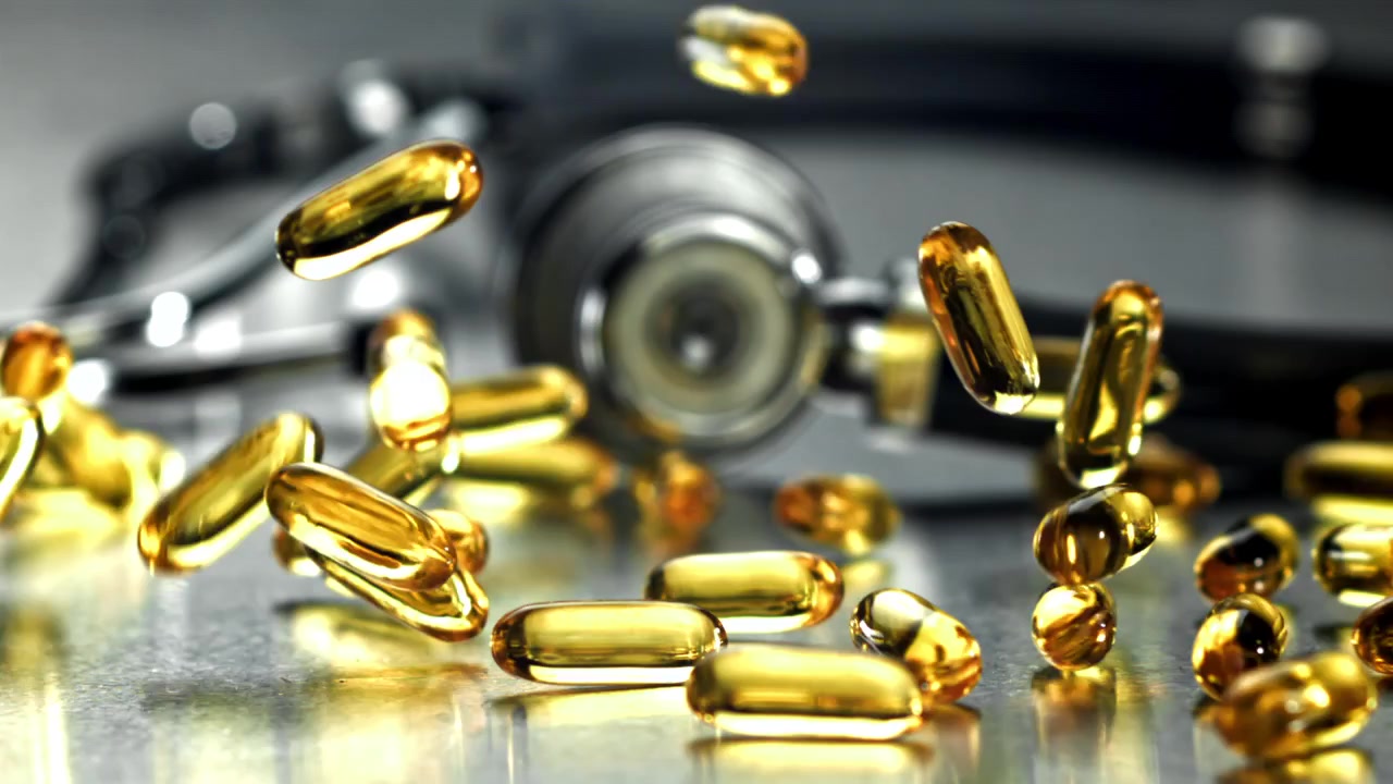 Medical Capsules Falling in Slow Motion with Stethoscope