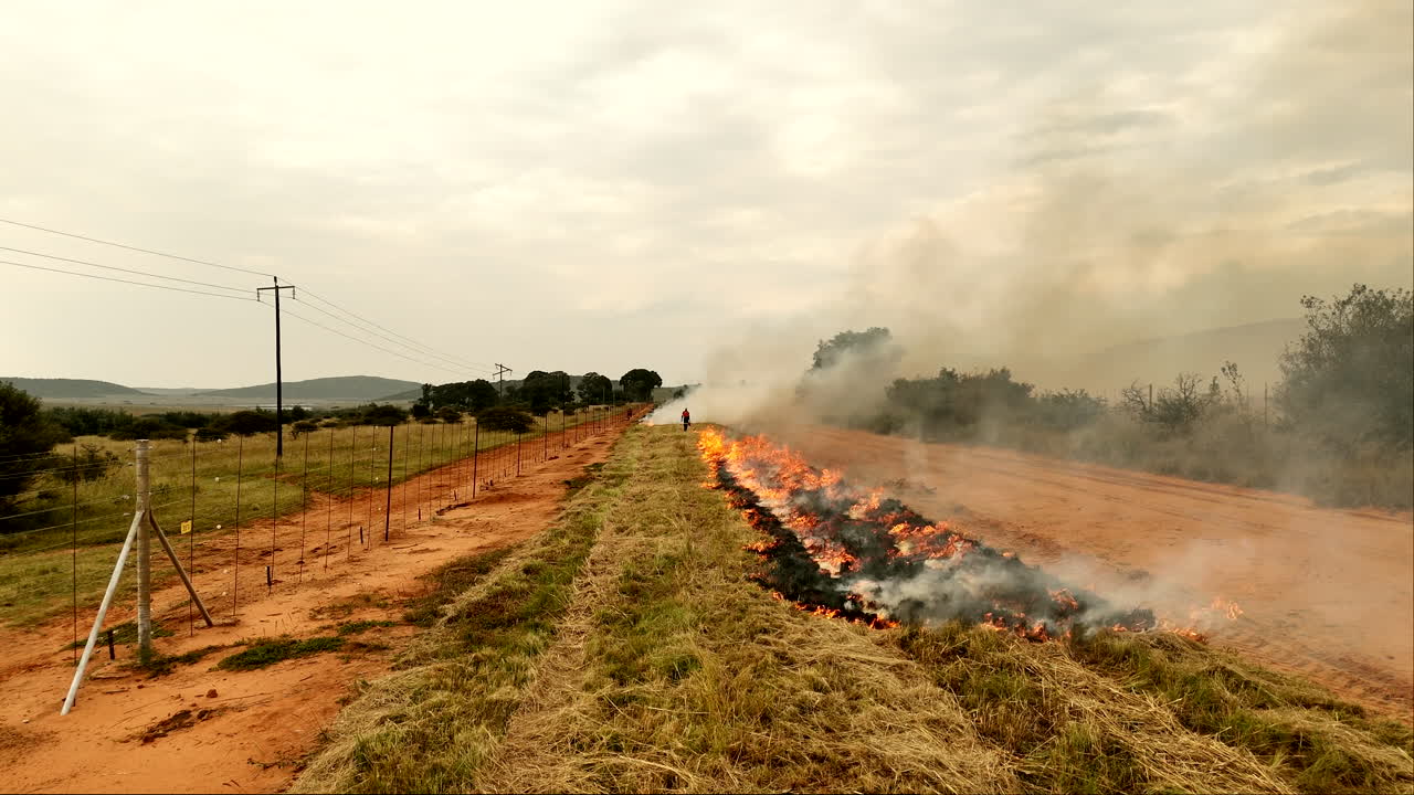 Firebreak burns done next to dirt road in rural South Africa before fire season