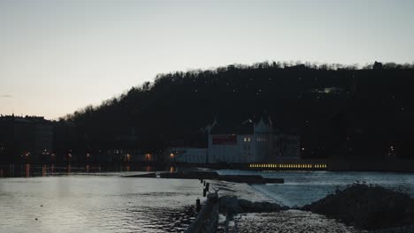 prague's museum kampa viewed from novotného lávka across the vltava at dusk