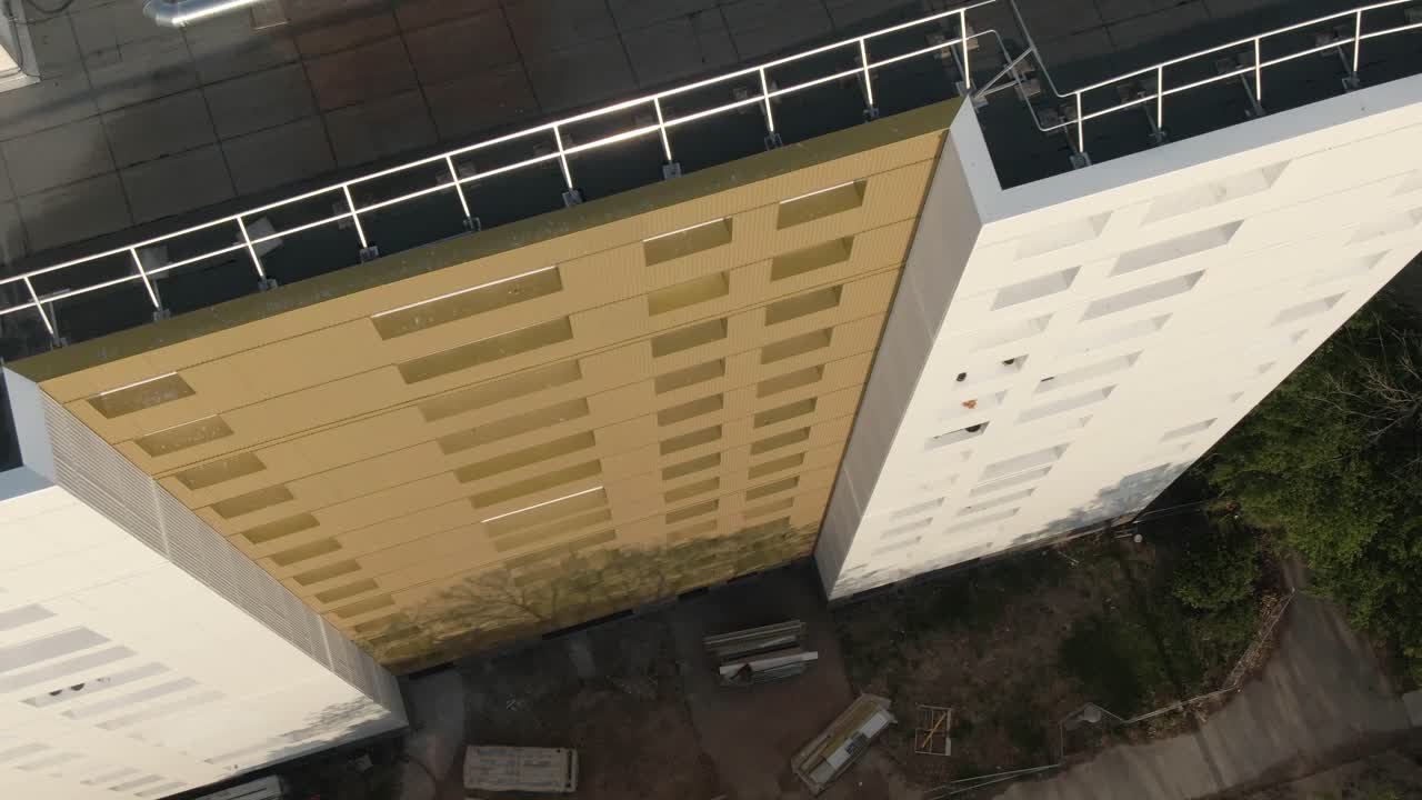 Drone offers a direct overhead view of building rooftops and urban pattern in Nantes, France. City planning, urban area overview