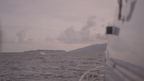 luxury boat trip looking ahead over subic bay with passing boat in the philippines