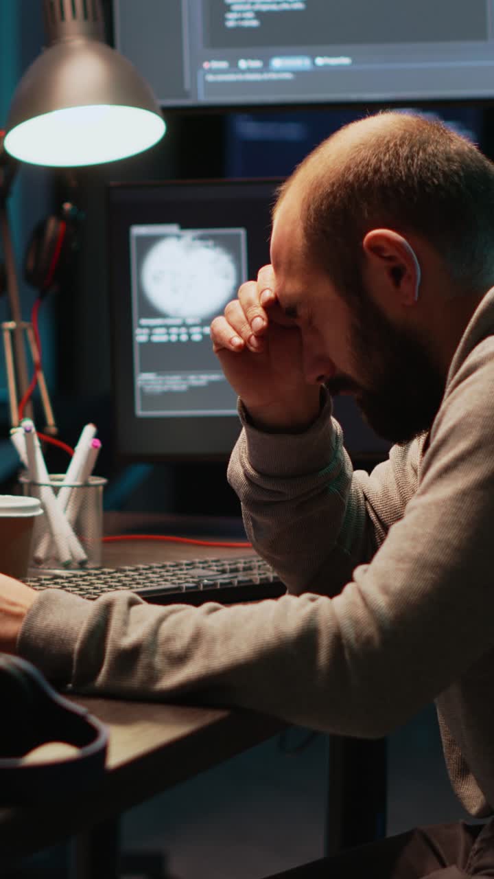 Vertical video: App developer feeling tired and fatigued at office job