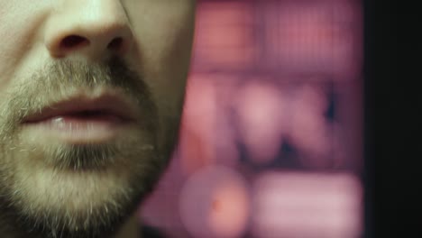 a man speaks seriously while ai-generated data and visuals glow behind him—symbolizing communication, control, and interaction with intelligent systems