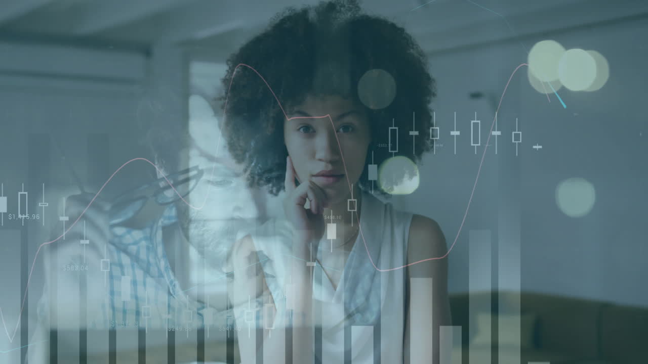 Analyzing financial graphs, individuals in office focusing on data animation work