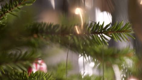 Tree-decorations-and-red-bauble-with-dedication-for-baby-first-Christmas