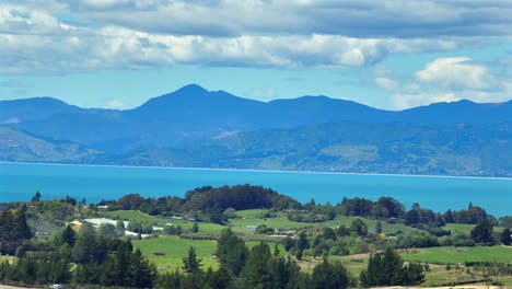 aerial drone shot of tasman bay and nelson in the distance, new zealand