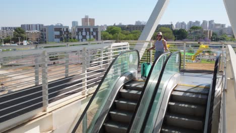 solo woman using airport stairs