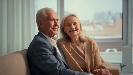 an elderly couple sharing a loving moment at home
