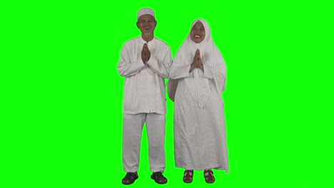 muslim senior couple showing congratulate gesture