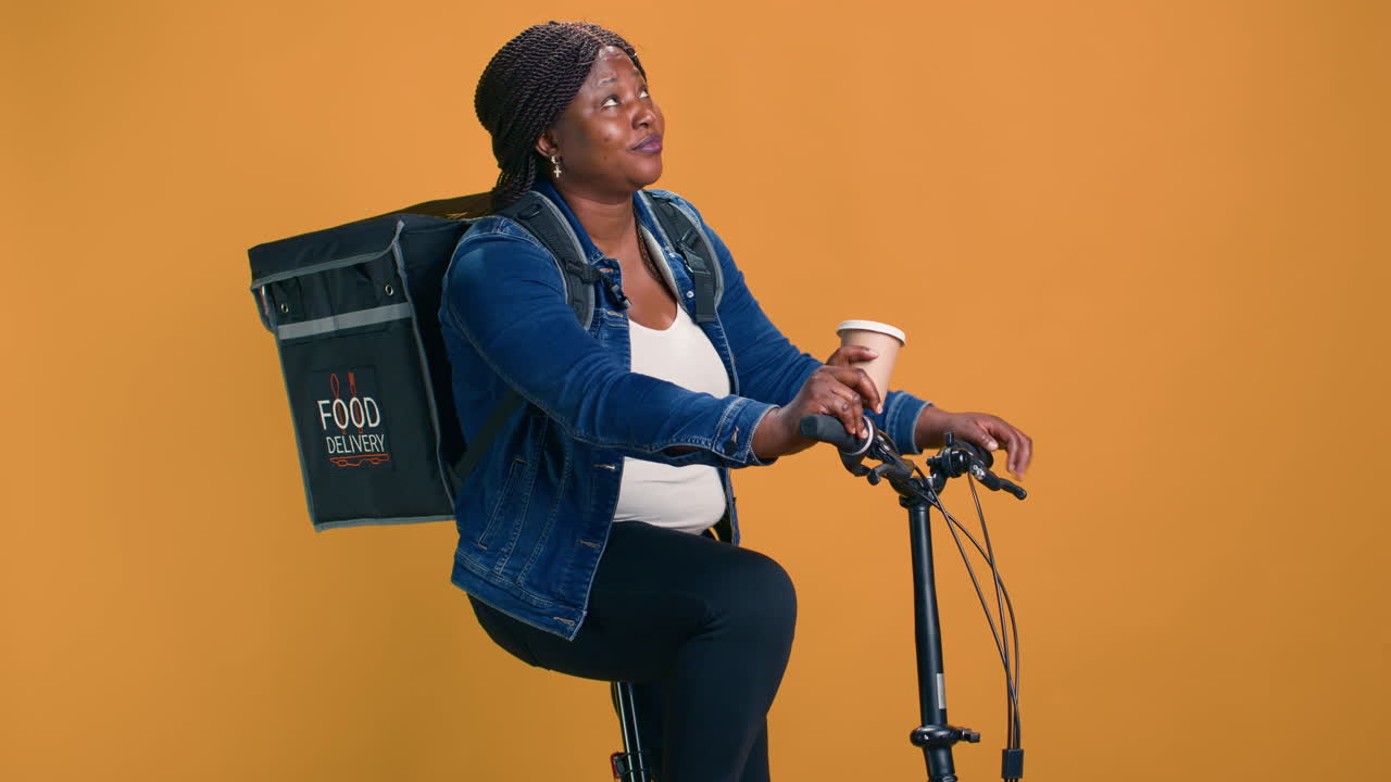 Delivery Woman On Bike Enjoying Coffee