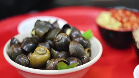 sequential display of snail dishes being served