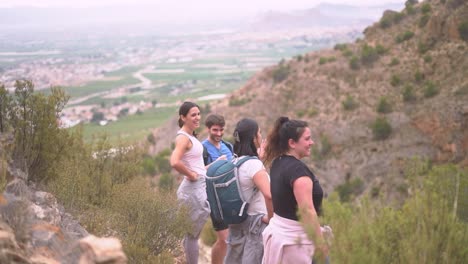 hikers group walk along a rout in the mountain