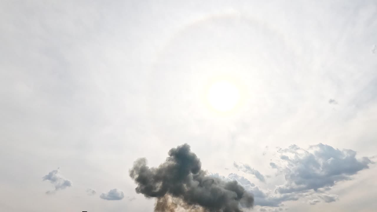 A powerful explosion with billowing smoke under a bright sky at the Avalon Airshow, captured in Geelong, Victoria