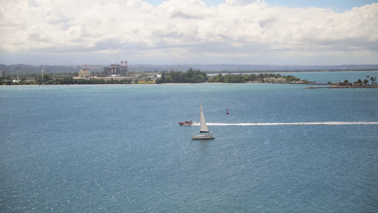 Aerial view of boats in the ocean water.