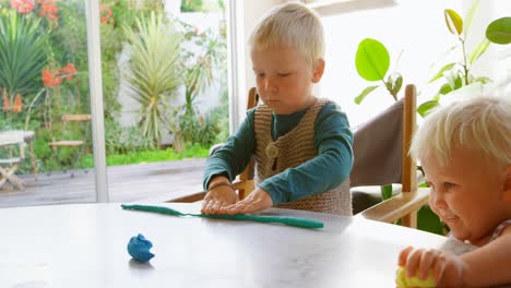 kids playing with clay in a comfortable home 4k