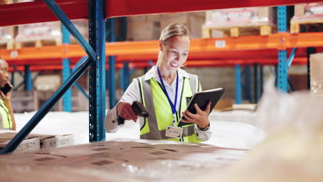 warehouse workers using a scanner and tablet to manage inventory