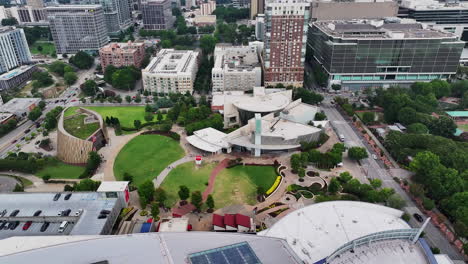 aerial view of park and futuristic design building in city