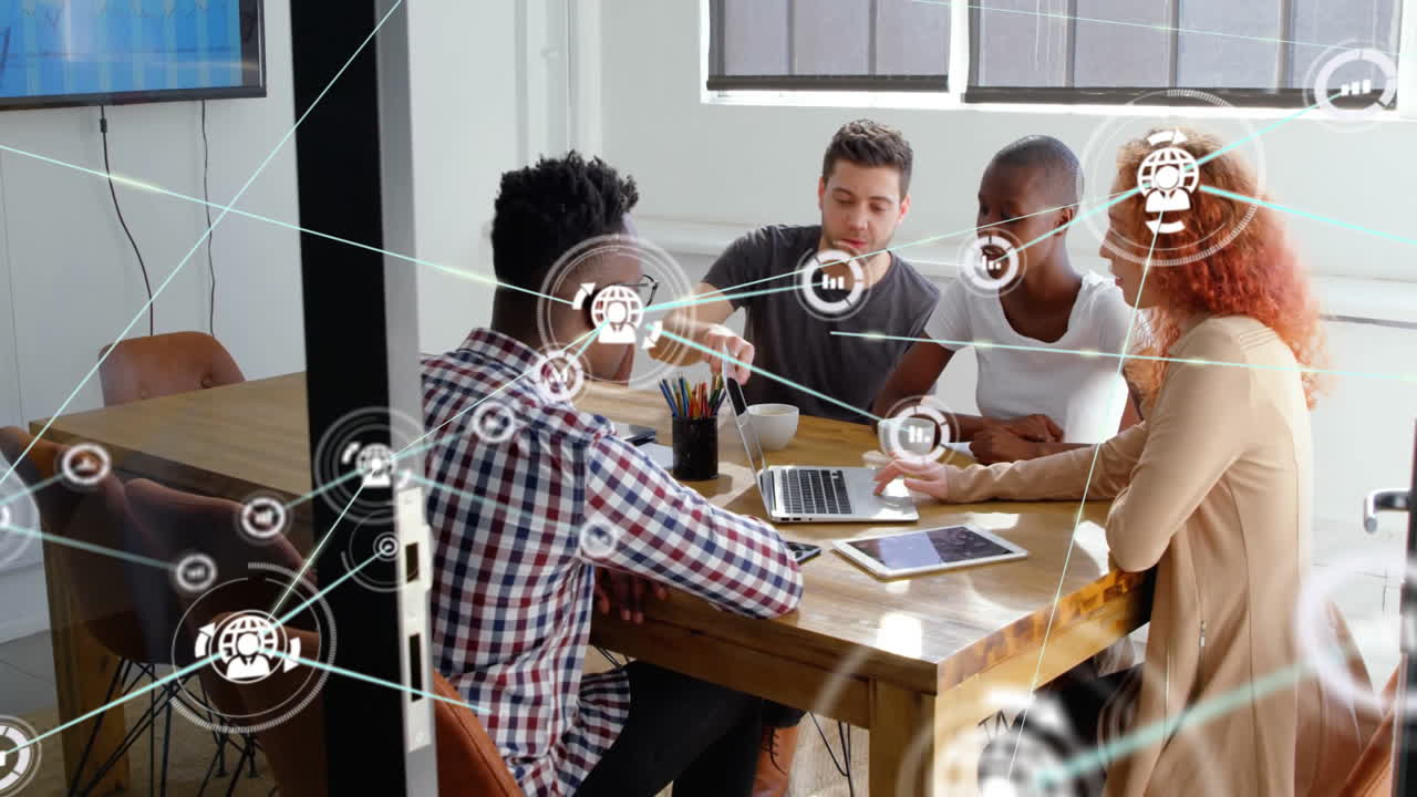 Animation of network of connections with icons over diverse business people talking in office