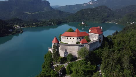 panorama of alpine glacier lake and castle with small island. footage with 4k high quality drone stock video