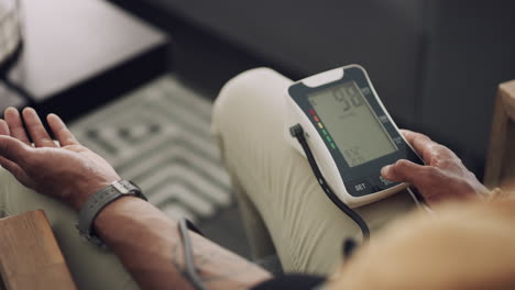 a-man-checking-his-blood-pressure-at-home