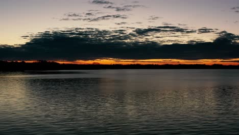 sunrise over a lake in rural wisconsin, usa