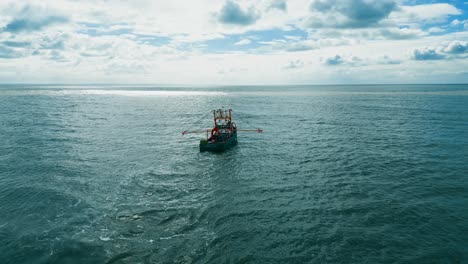 fishing trawler boat ship sailing into the midday