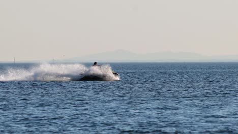 jetski rider performing stunts on the ocean