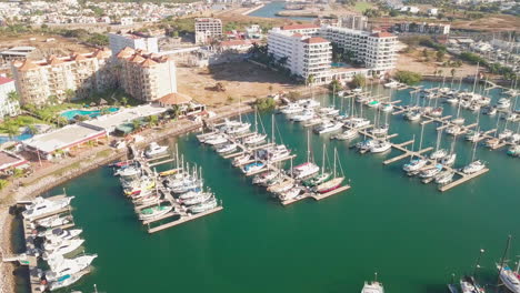 aerial overview of beautiful harbor near luxurious hotels in sunny mexico