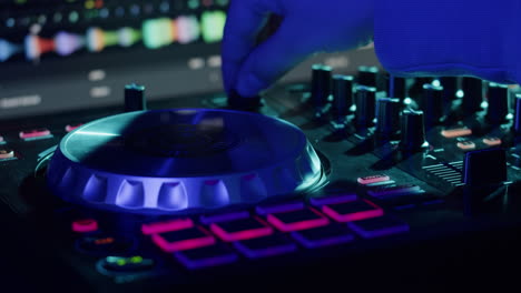 dj with headphones and sunglasses playing music on festival in night club. techno musician performing at nightclub for concert crowd of people, city bar.
