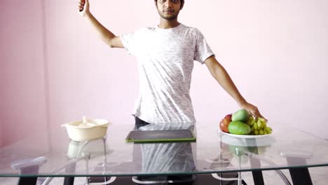 man making fruit salad at home