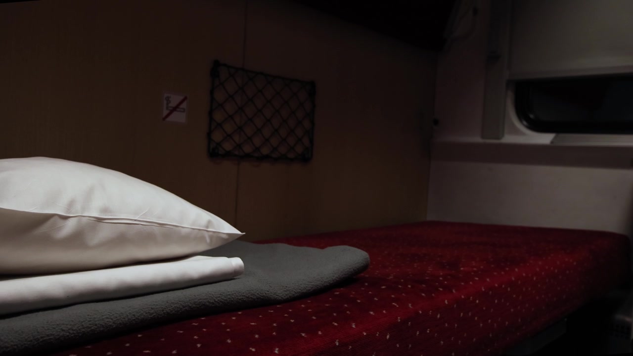 Bed in night train cabin, moving overnight train establisher
