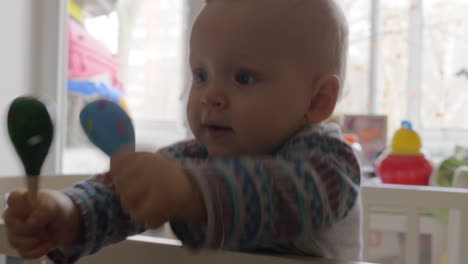 Cute-baby-caucasian-girl-in-a-round-crib-9