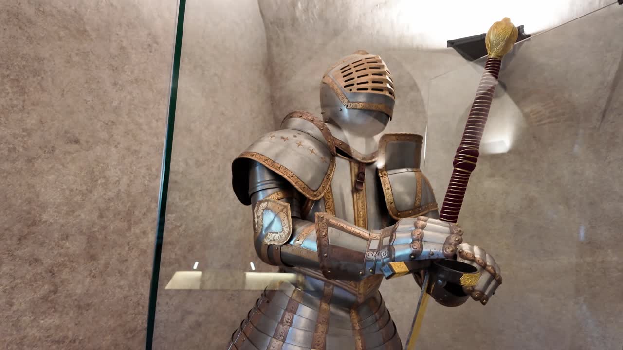 Medieval decorated knight's armor with a two-handed sword - castle museum