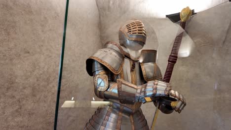 medieval decorated knight's armor with a two-handed sword - castle museum
