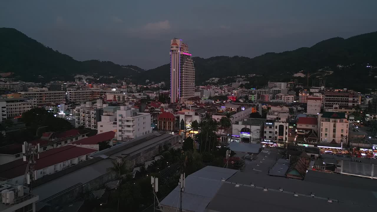 Nighttime Cityscape with Mountains