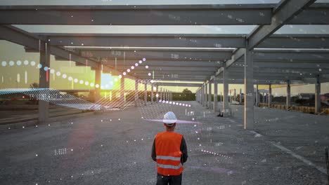 ingeniero caminando en el sitio de construcción con gráficos digitales de los crecientes costos en la industria de la construcción