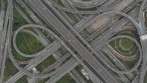 high angle looking top down view of complicate road and expressway intersection in bangkok city of thailand. shot by drone can use for transportation or abstract concept.