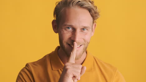 young bearded man nodding head while ask to keep the secret