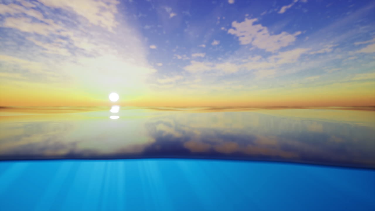 Beautiful sunset over calm ocean water reflects vibrant colors