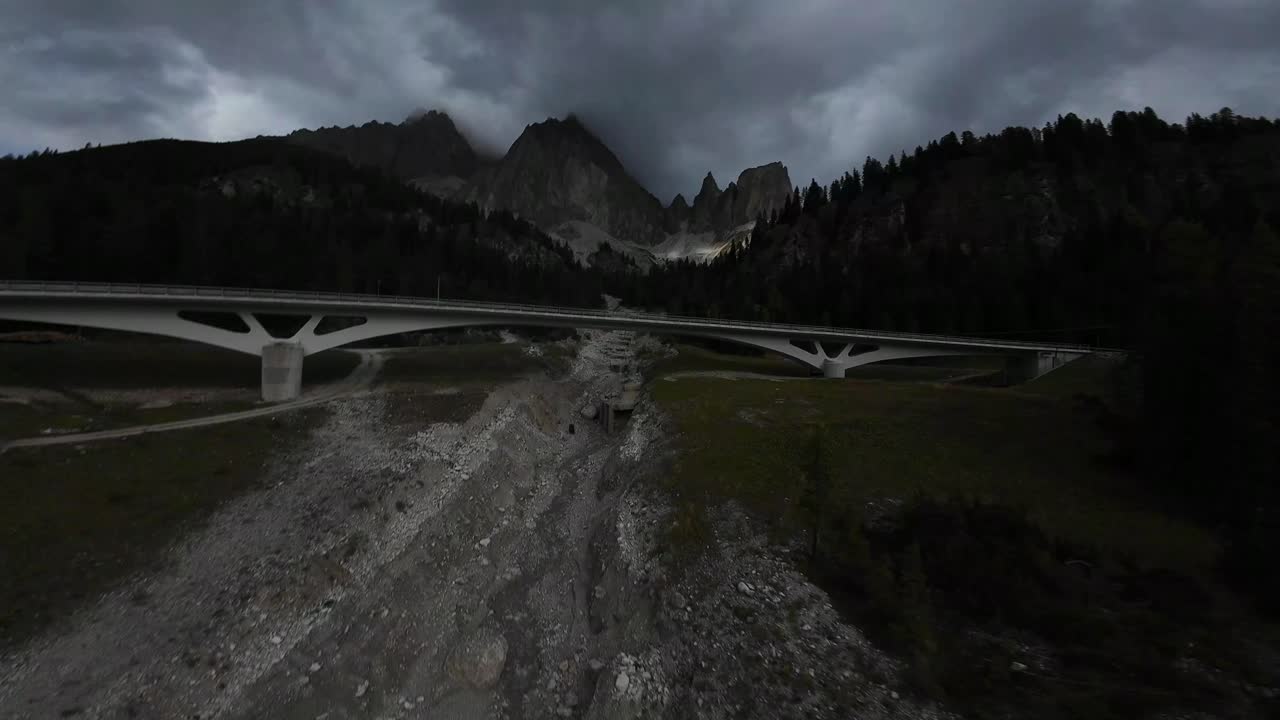 Car bridge in the Dolomites, Italy, captured with aerial FPV drone video