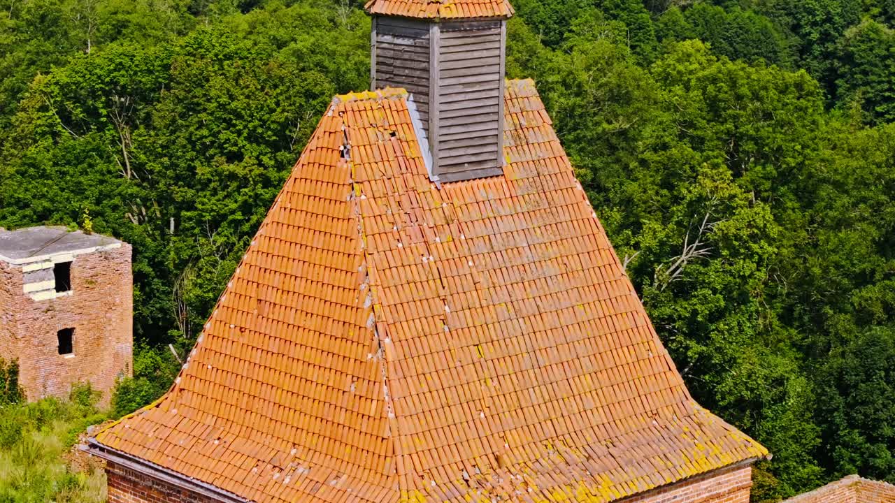 Aerial historic Pomezania Castle ruins Poland reflecting global conflict trauma