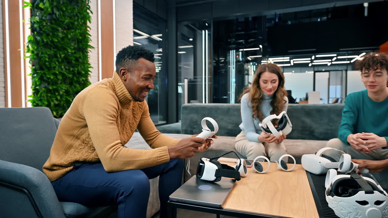 Business conference in VR in an office. Multiracial group of people holding and talking about VR glasses and controllers
