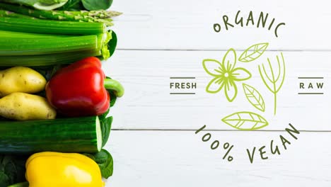 Animation-of-organic-100-percent-vegan-text-in-green,-over-fresh-vegetables-on-white-boards