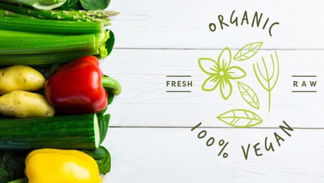 animation of organic 100 percent vegan text in green, over fresh vegetables on white boards