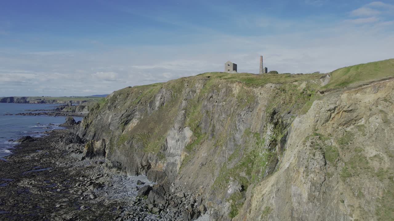 Ireland coastline drone rising to reveal the countryside of Co. Waterford in the shadow of the Comeragh Mountain range epic Landscapes