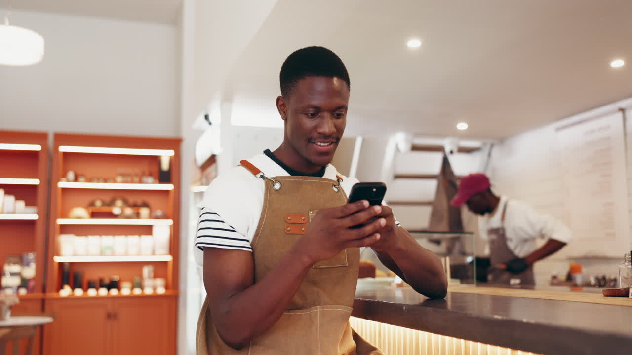 Man using smartphone in cafe