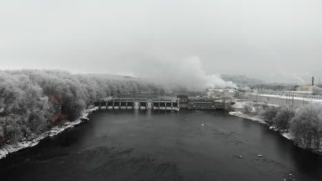 River-dam-in-the-winter-surrounded-with-frost-covered-trees